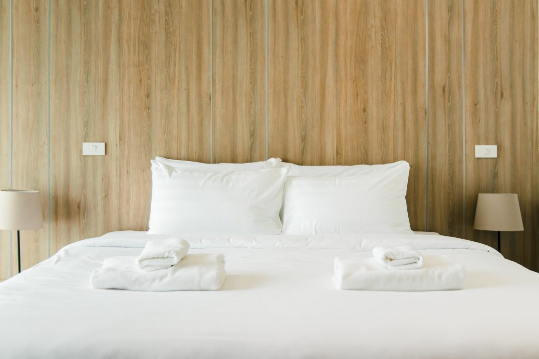 clean-bedroom-at-hotel-wood-tone.jpg